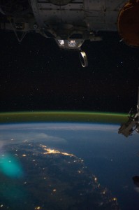 Image courtesy NASA. This unique photographic angle, featuring the International Space Station's Cupola and crew activity inside it, other hardware belonging to the station, city lights on Earth and airglow was captured by one of the Expedition 28 crew members. The major urban area on the coast is Brisbane, Australia. The station was passing over an area southwest of Canberra.